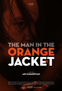 The man in the orange jacket