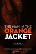 The man in the orange jacket